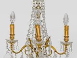 a close up of a chandelier with two lights on it