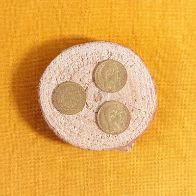 a piece of bread that has four coins on it