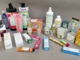many different types of skin care products laid out on a table