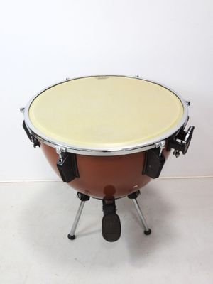une image représentant un timbale avec une partie supérieure jaune et des pieds noirs
