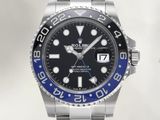 a rolex watch with a blue bezel on the bracelet
