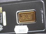 a close up of a gold bar with a price tag on it