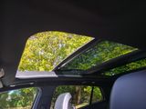 a view of the sunroof from inside of a car