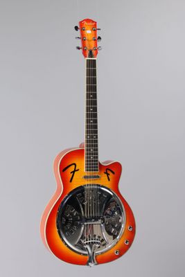 an orange electric guitar with a black fretset sitting on a stand