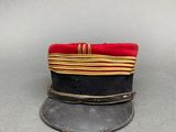 an image of a hat with a red ribbon on it