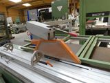 a machine that is cutting a piece of metal