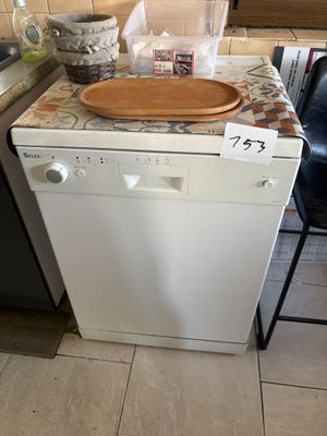 a dishwasher sitting on a counter in a kitchen