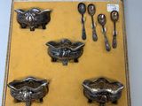 a box with silver spoons and spoons in it