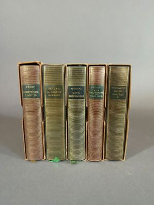three books are stacked on top of each other on a table