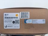 a box with a barcode on it that is in someone ' s hand