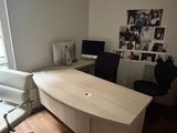 a desk and chair in the corner of a room