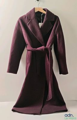 an image of a coat hanging on a wall