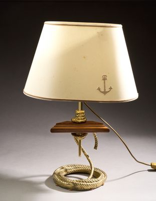 an image of a lamp with a rope and a lamp shade on top of it