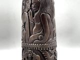 an image of a wooden sculpture of a woman and a cat