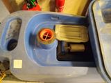 a blue plastic container with a hose attached to it