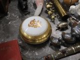 a gold and white box on a table surrounded by other items