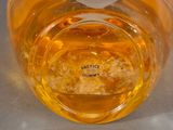 a jar of honey sitting on a table with a label on it
