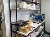 a kitchen with a lot of food on the shelves