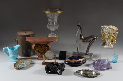 many different types of glass items displayed on the table