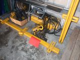a yellow machine that is sitting in a garage
