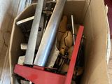 a cardboard box with a bunch of tools inside of it