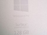 a close up of the windows 8 pro logo on the back of a laptop