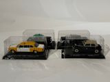two toy cars that are sitting in a display case