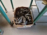 a basket full of assorted items sitting on the floor