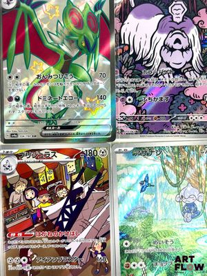 several pokemon cards are displayed on a table in front of a window