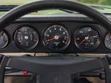 a steering wheel and gauges in the dashboard of a car