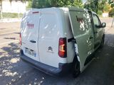 a white van that is parked on the side of the road