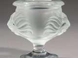 a glass vase that is sitting on a table