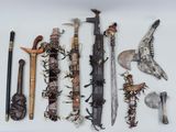 many different types of weapons displayed on a white surface