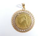 an image of a gold coin pendant with a woman ' s face on it