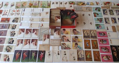 a lot of cards on a table with a box of them