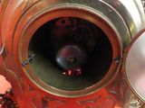 a close up of a clock that is on a table