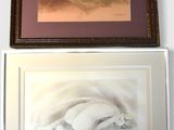 two paintings on the wall above a picture of a woman