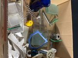 a cardboard box with various items in it on a table
