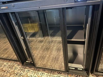 an image of a commercial refrigerator with glass doors