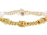 a close up of a bracelet on a white background