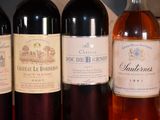 several bottles of wine are lined up on a table