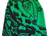 the skirt is green and black with a picture of a horse on it