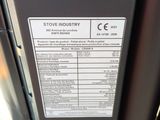 a close up of a metal door with a sign on it