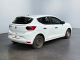 the rear end of a white car parked in a white room