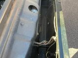 a close up of the inside of a car ' s engine compartment