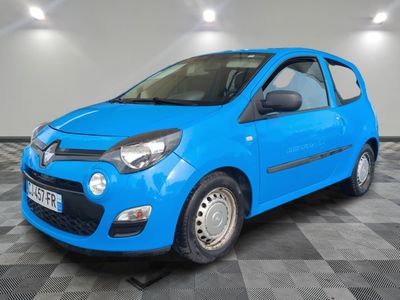 a blue car is parked on a checkered floor in a garage