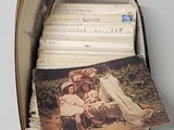 a box full of old photos of people and children