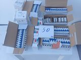 boxes of electrical equipment are stacked on top of each other
