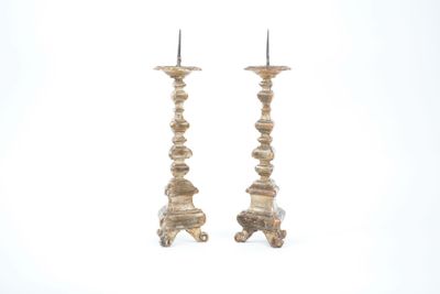 pair of antique wooden candlesticks with candlesticks on each side