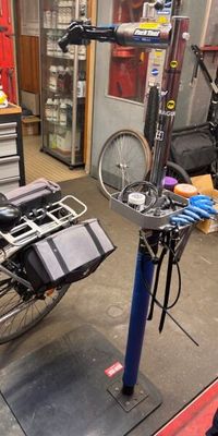 a bike that is sitting on a stand in a garage